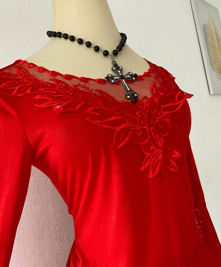 Bell-sleeved red top