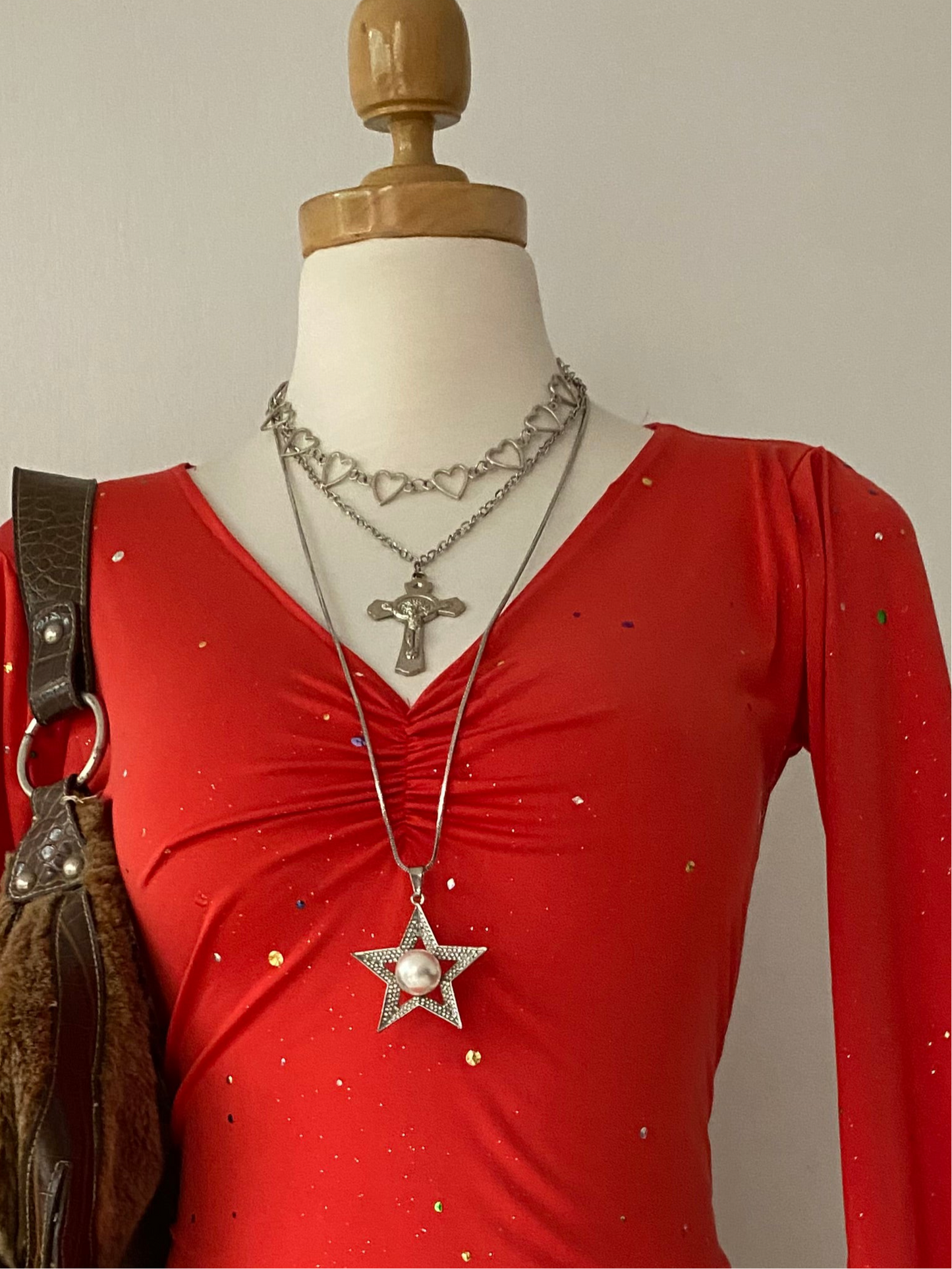Bell-sleeved top with appliqués