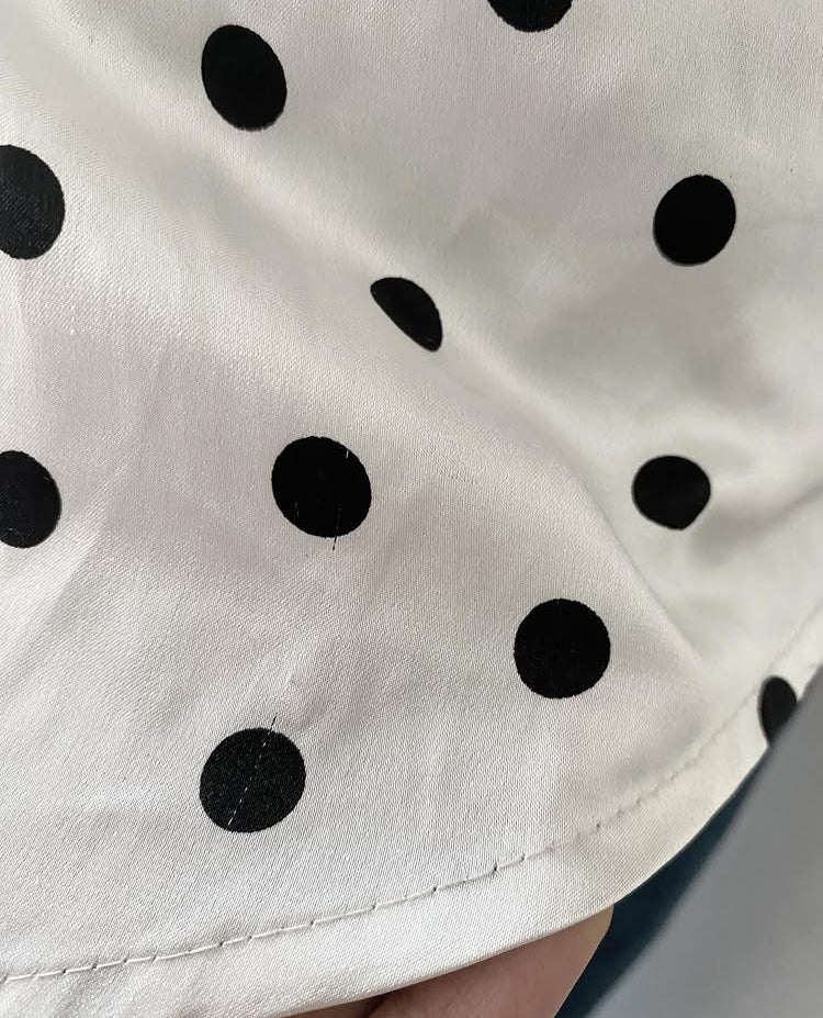 Polka dot top with knitted vest