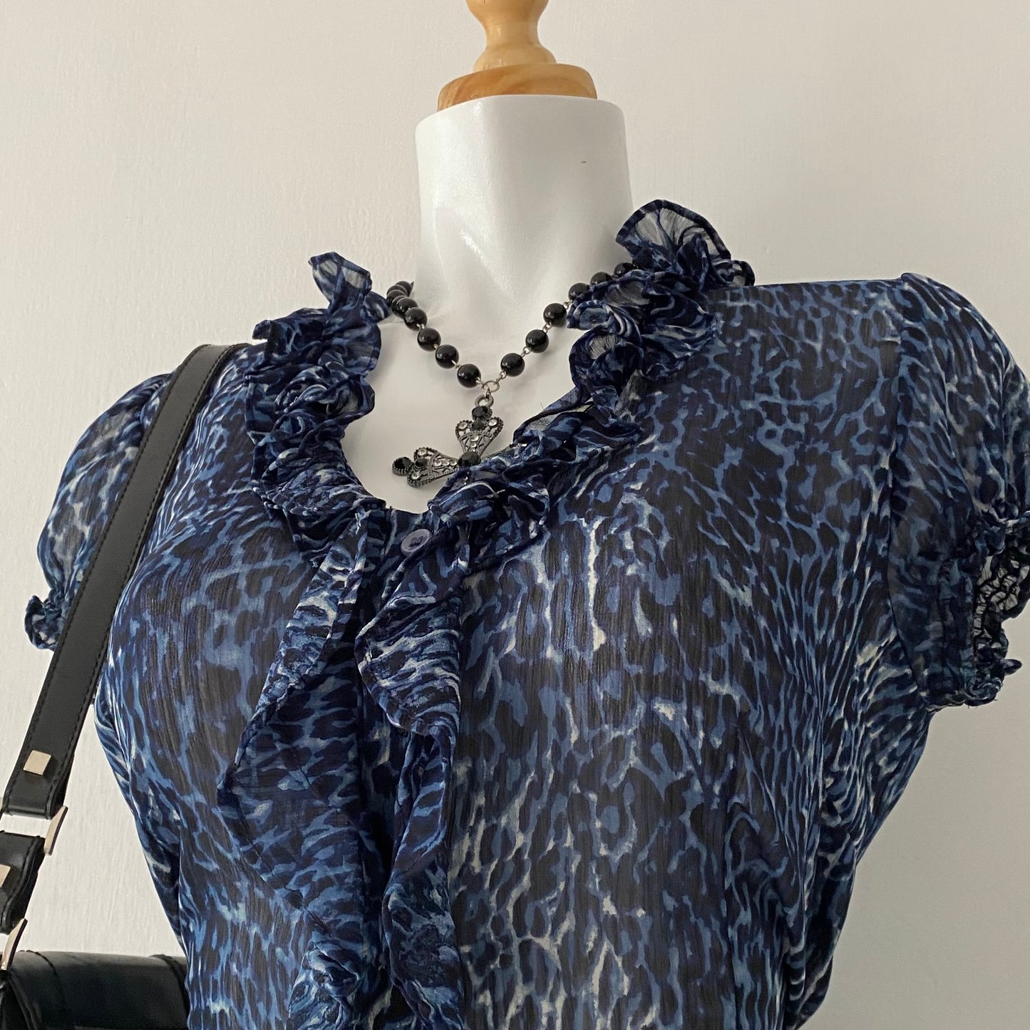 Cheetah print blouse with bow on the back
