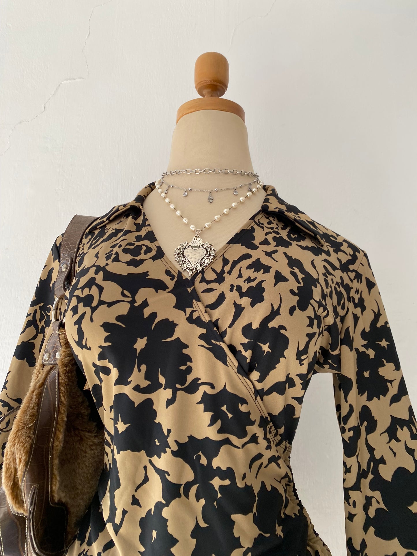 Beige and black crossover blouse