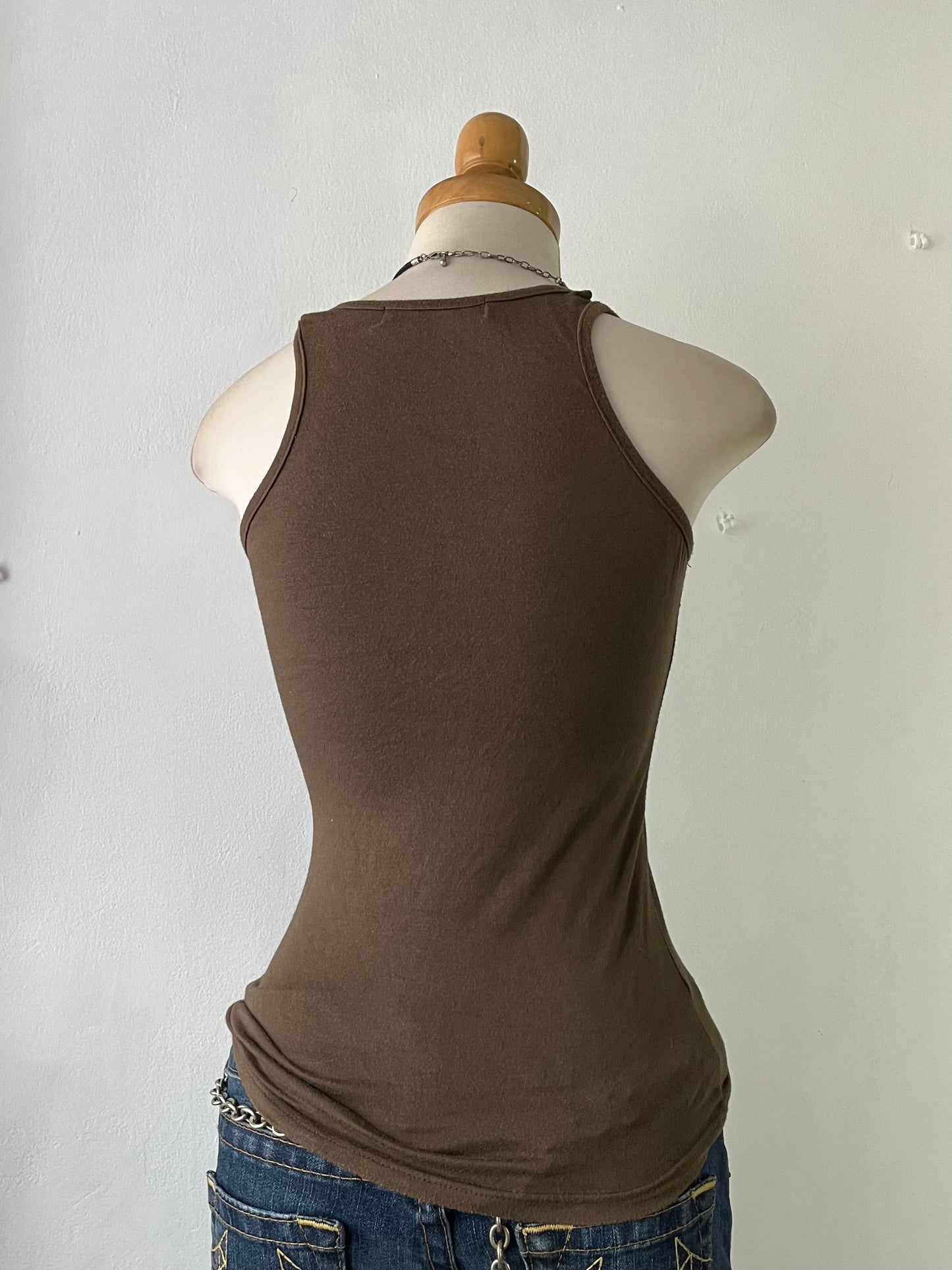 Top with embroidered butterfly design