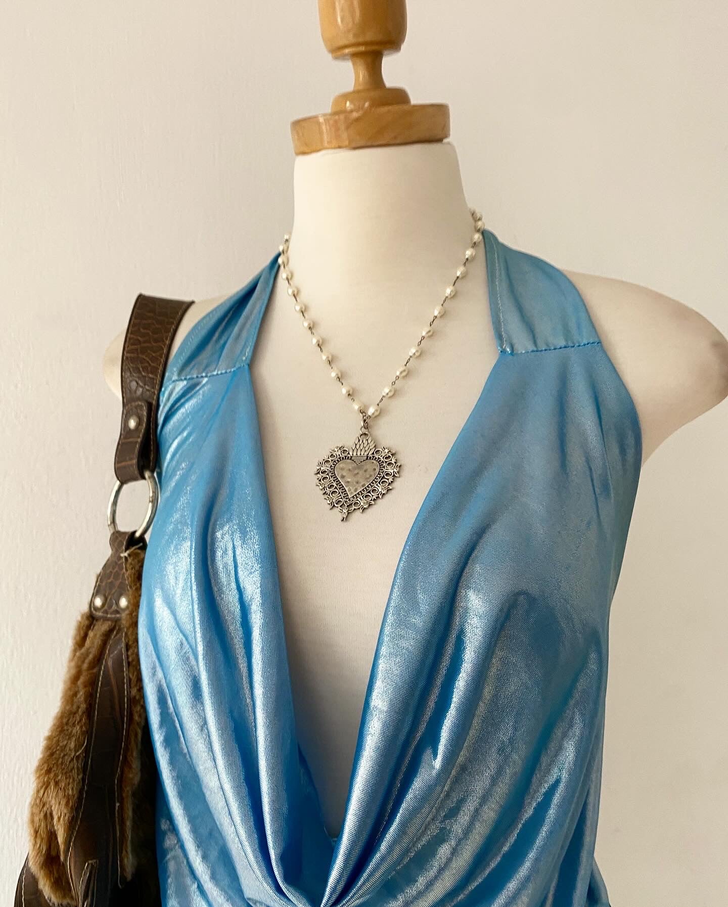 Top tornasol celeste