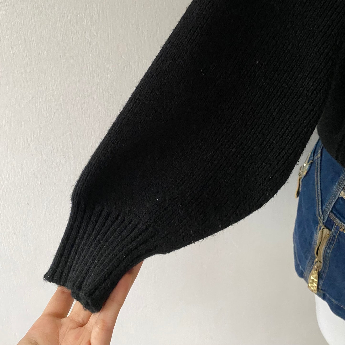 black sweater with animal print appliqués