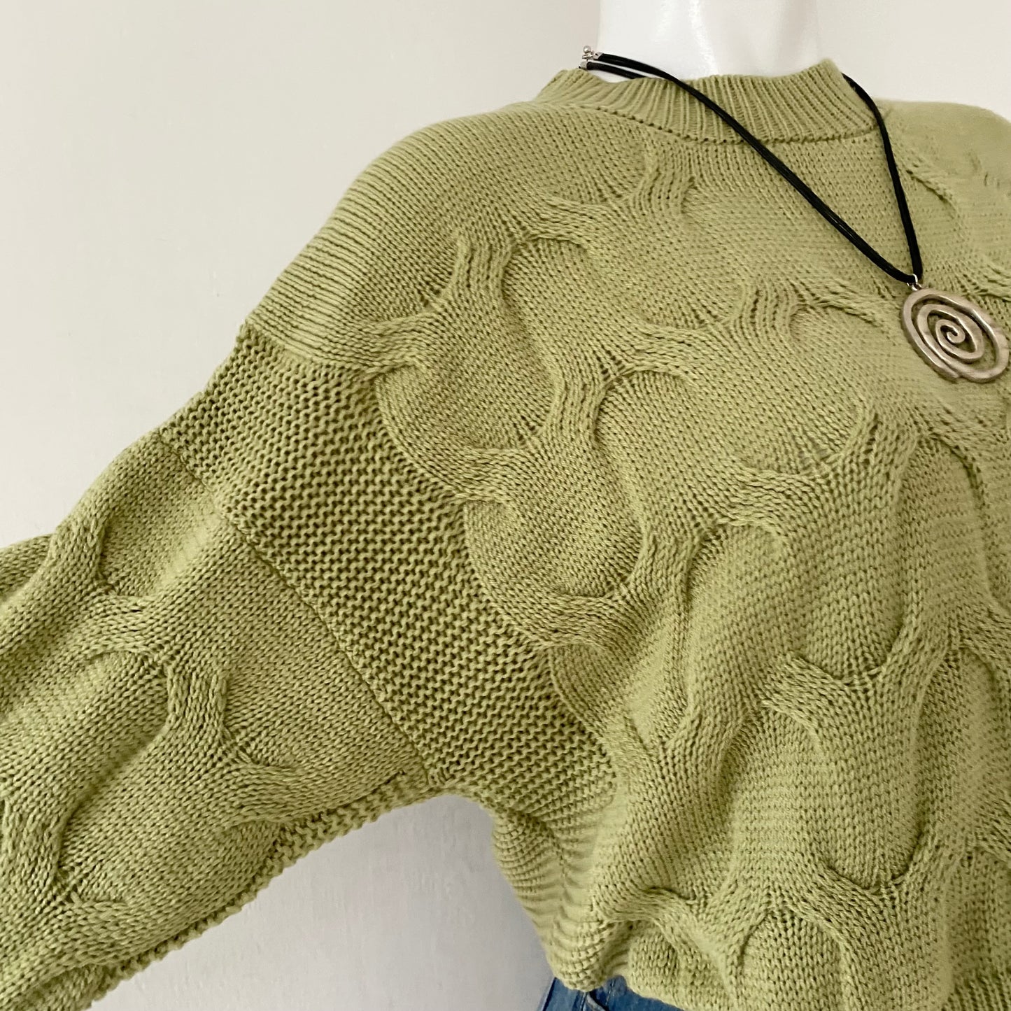 Waist-high sweater with braided design