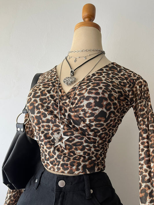 Animal print wrap-around blouse with flared sleeves