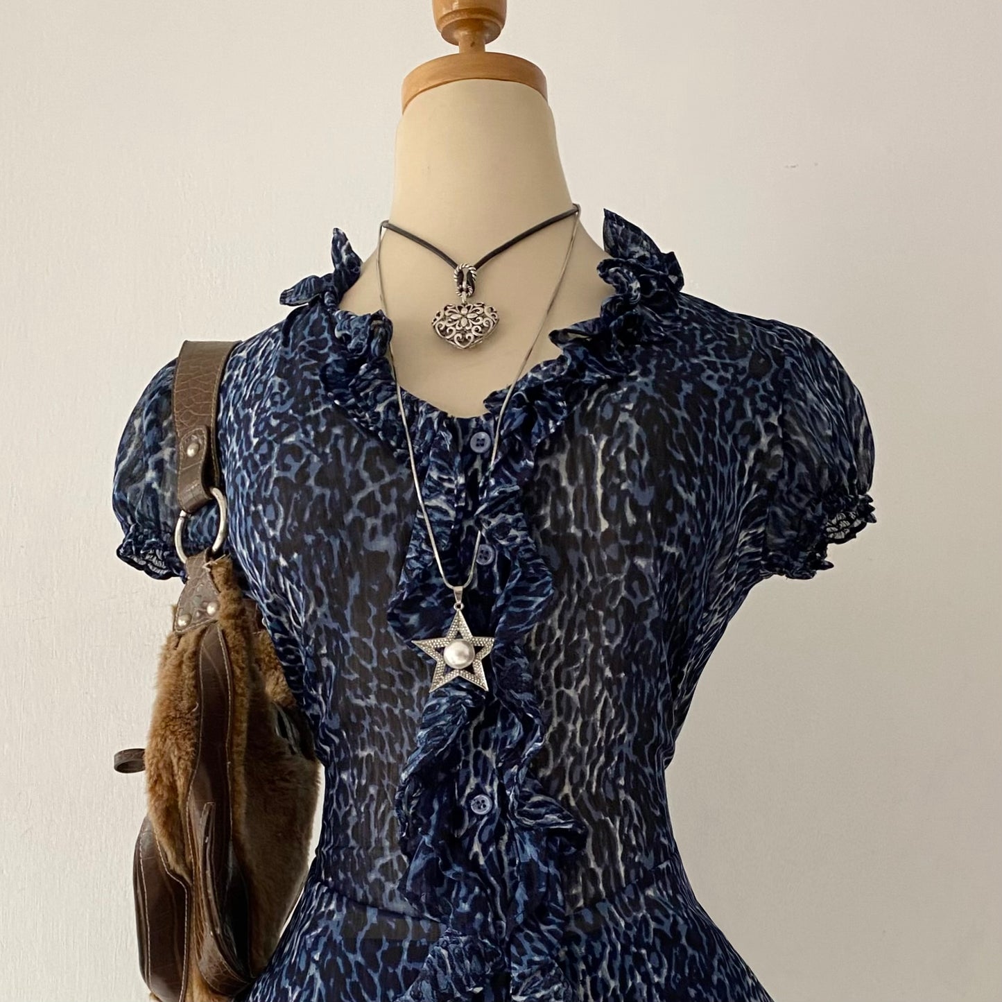 Cheetah print blouse with bow on the back