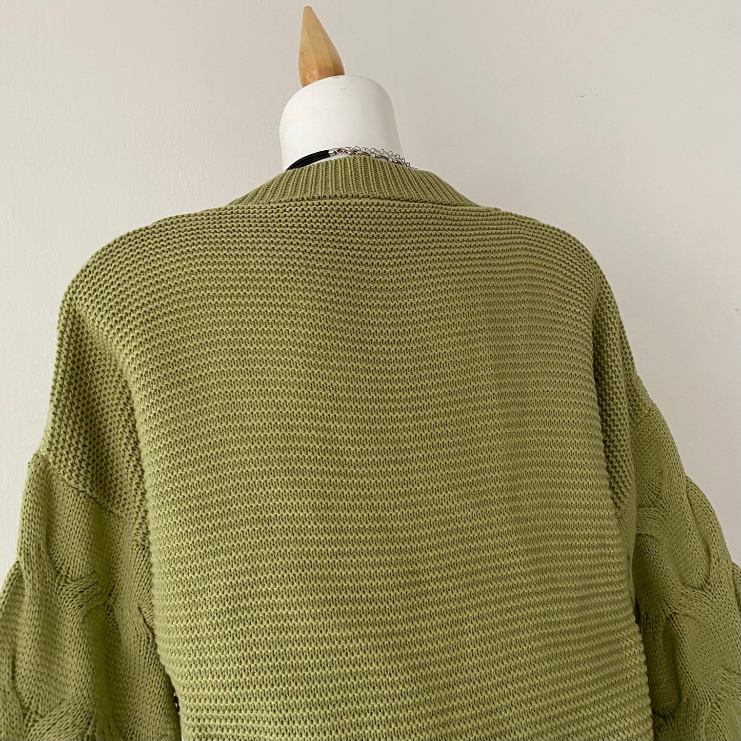 Waist-high sweater with braided design