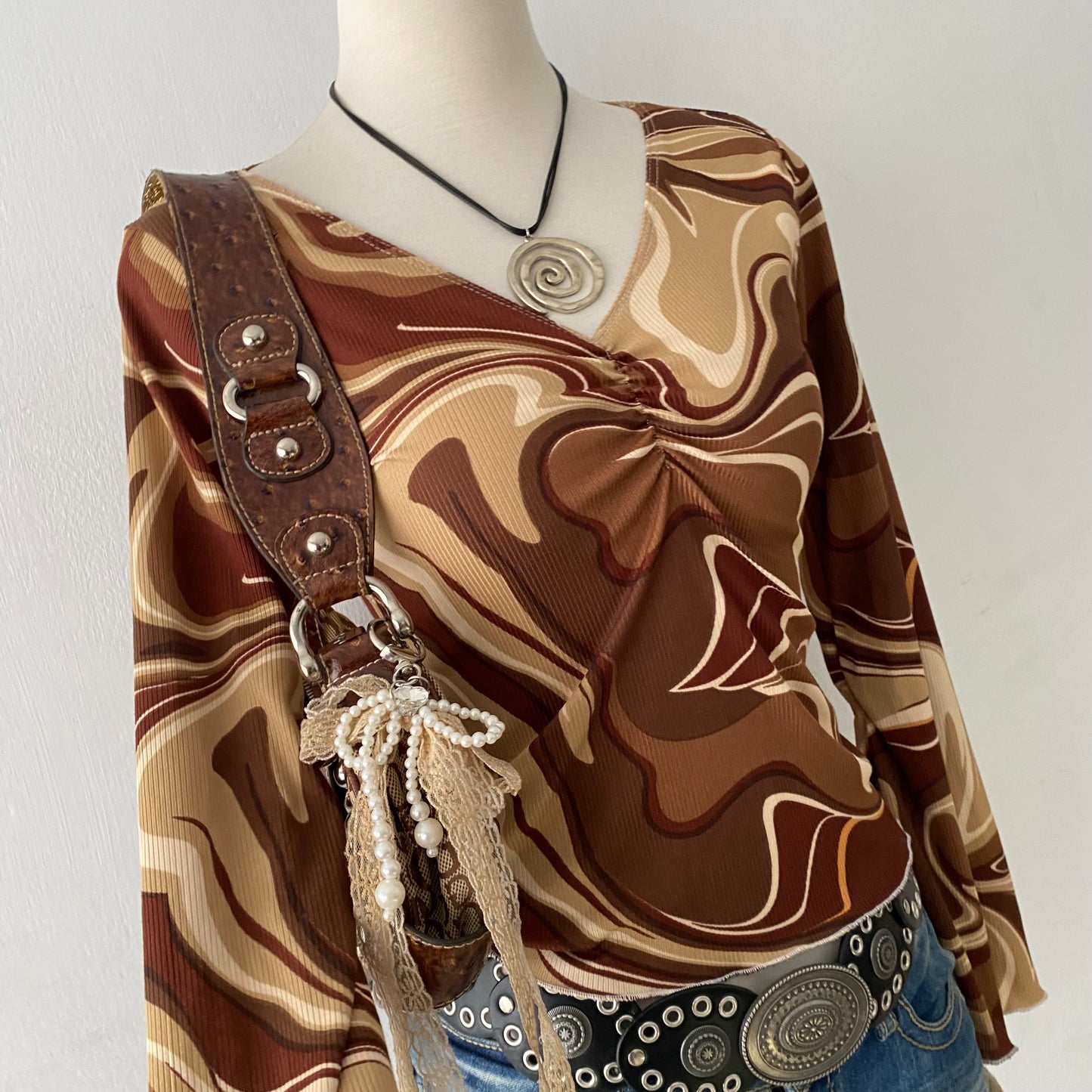 Bell-sleveed top