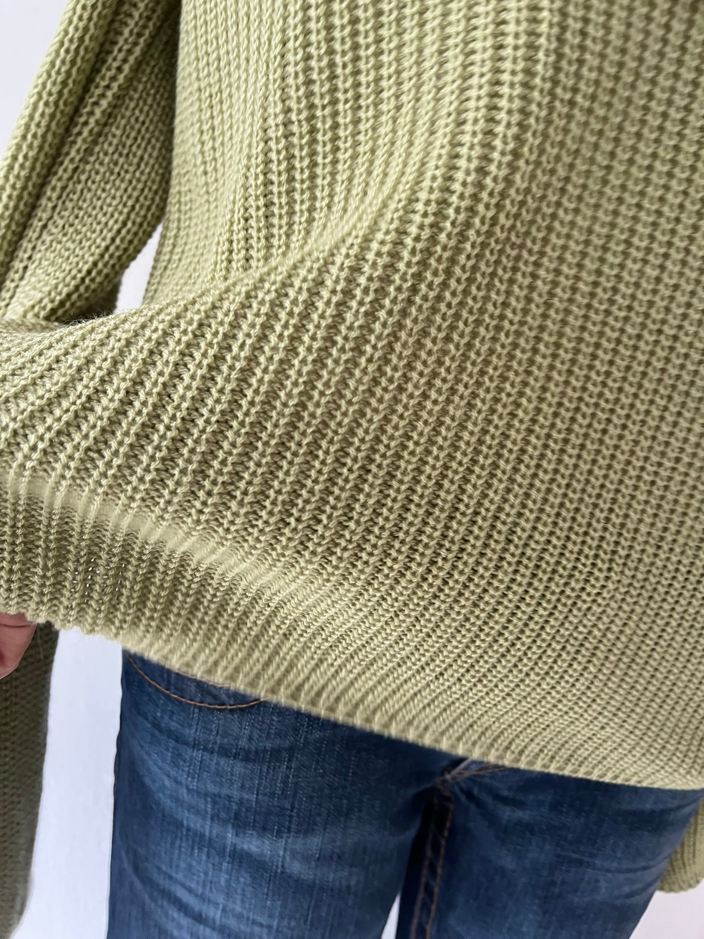 Oversized olive green sweater with flared sleeves