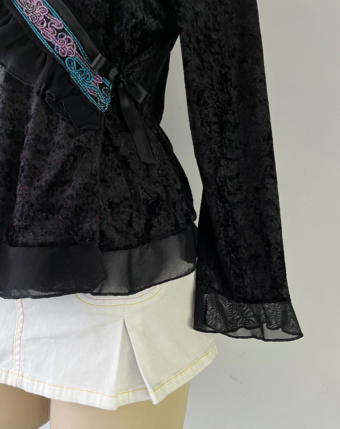 Wrap blouse with embroidered designs
