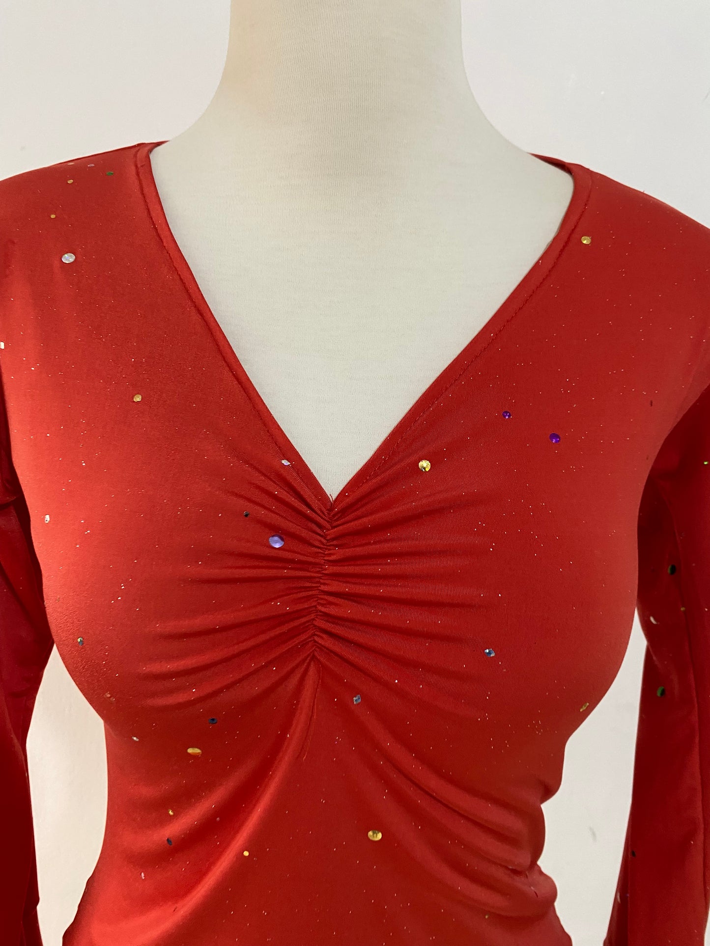 Bell-sleeved top with appliqués