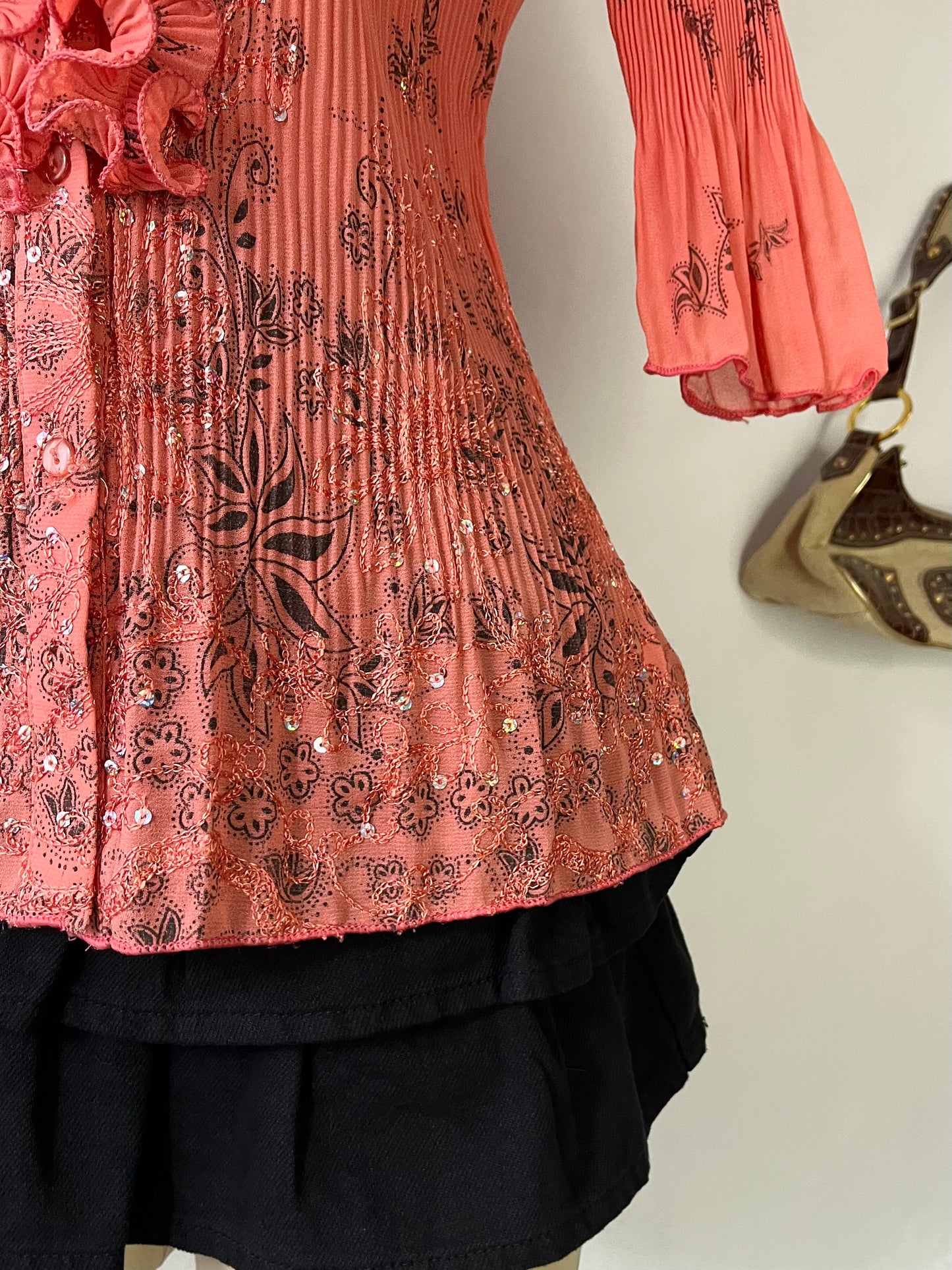 Coral top with embroidered designs