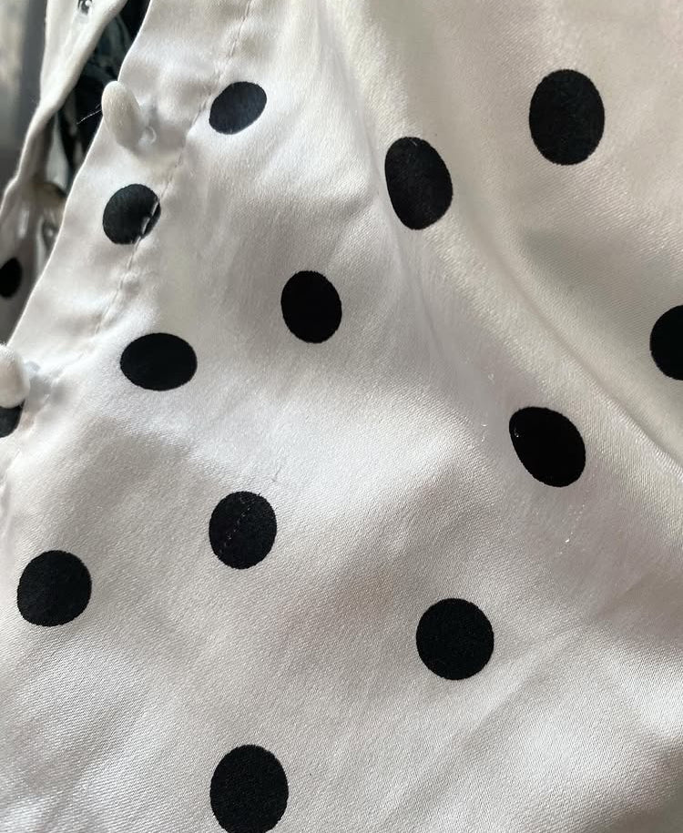 Polka dot top with knitted vest