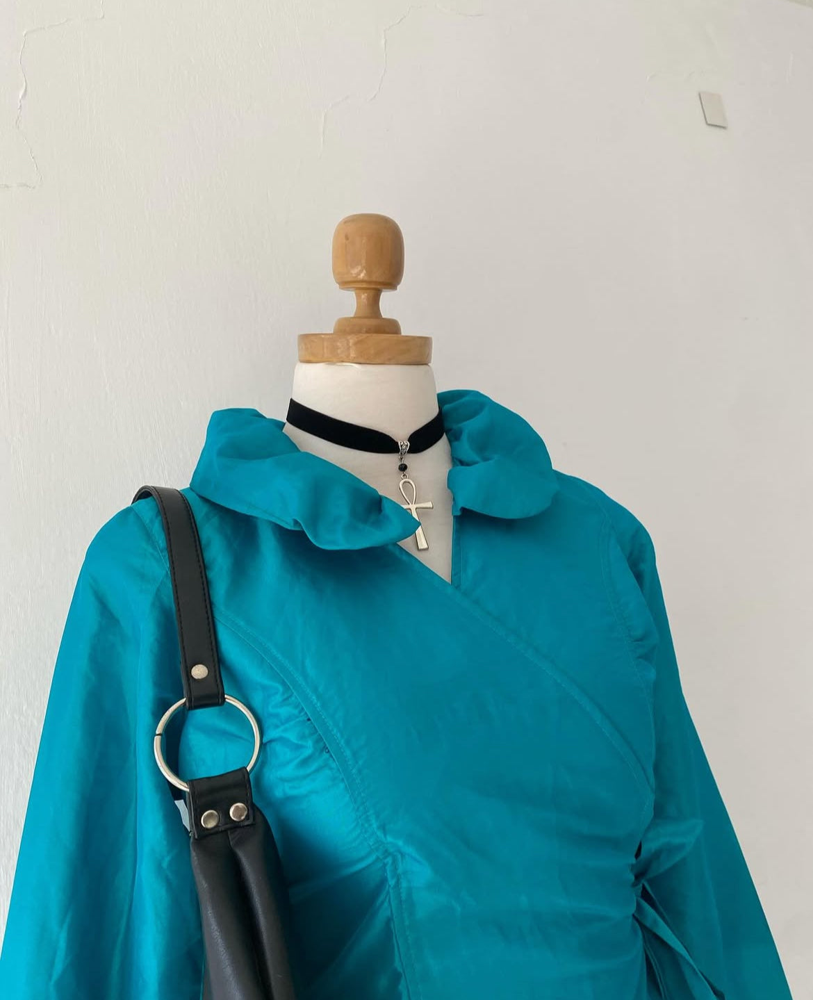 Turquoise blouse with bow