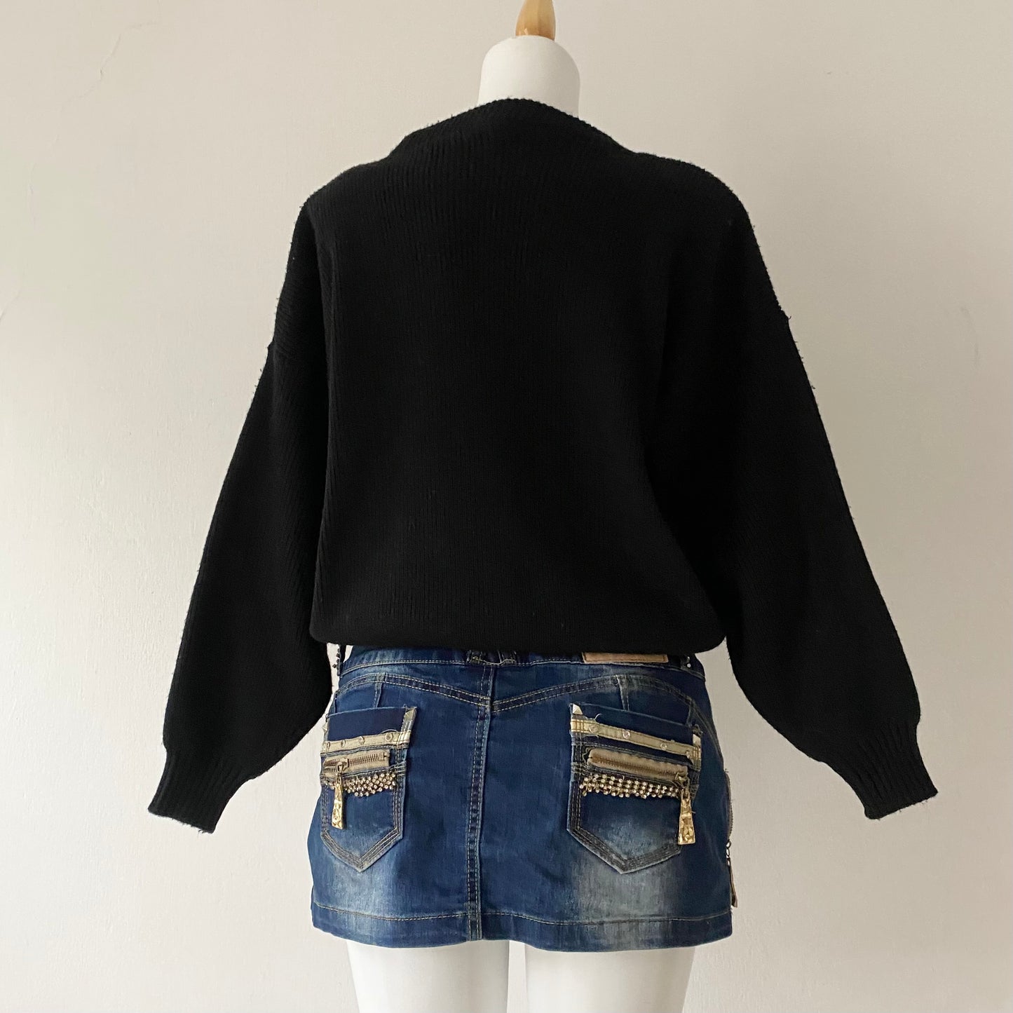 black sweater with animal print appliqués