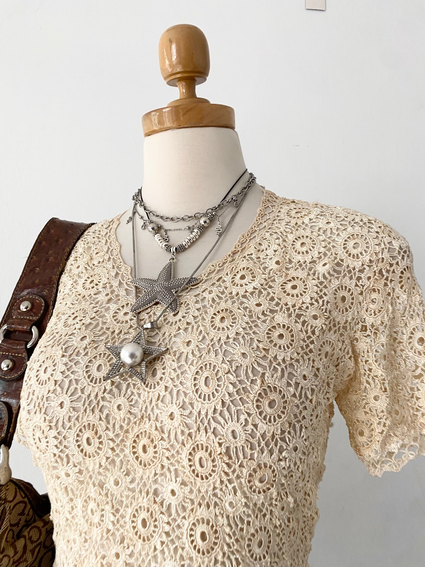 Knitted macrame top with back bow