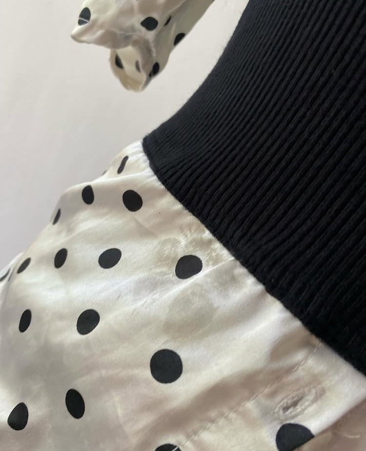 Polka dot top with knitted vest