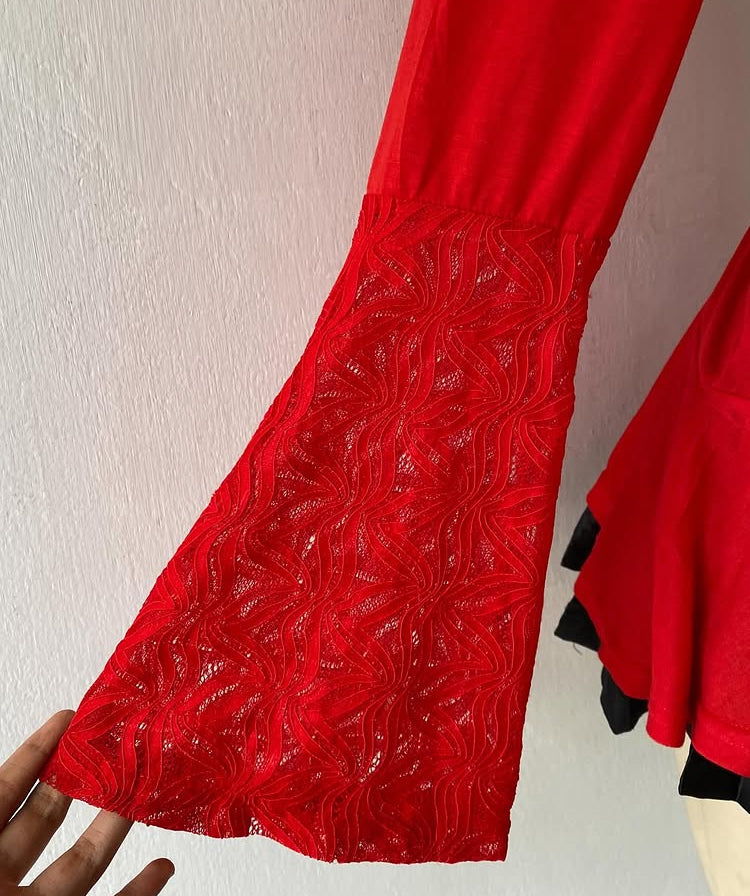 Bell-sleeved red top