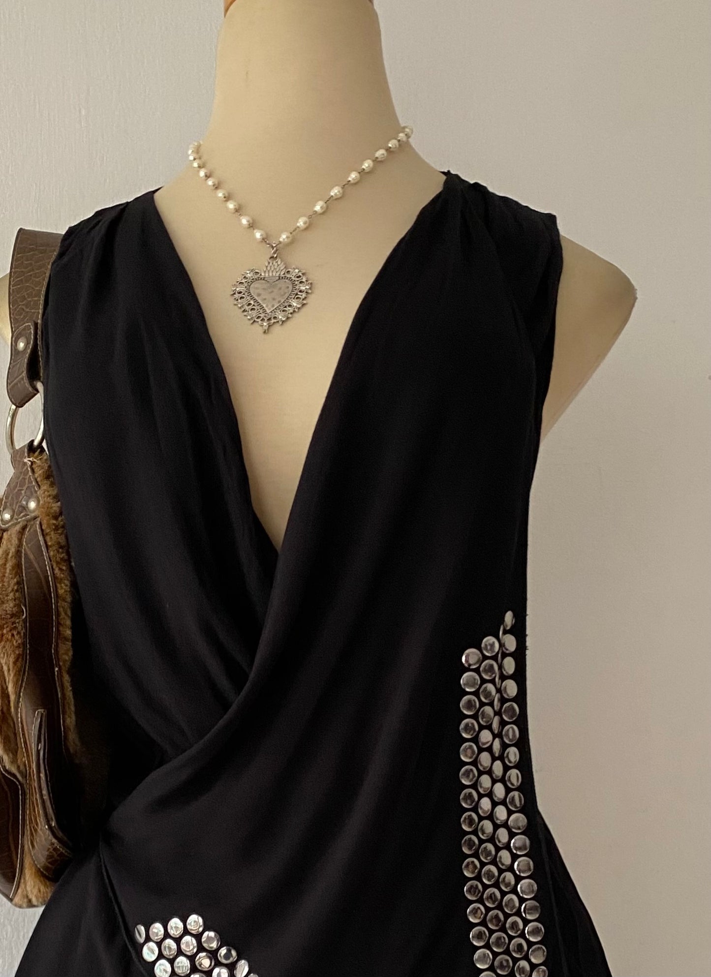 Black top with silver appliqués