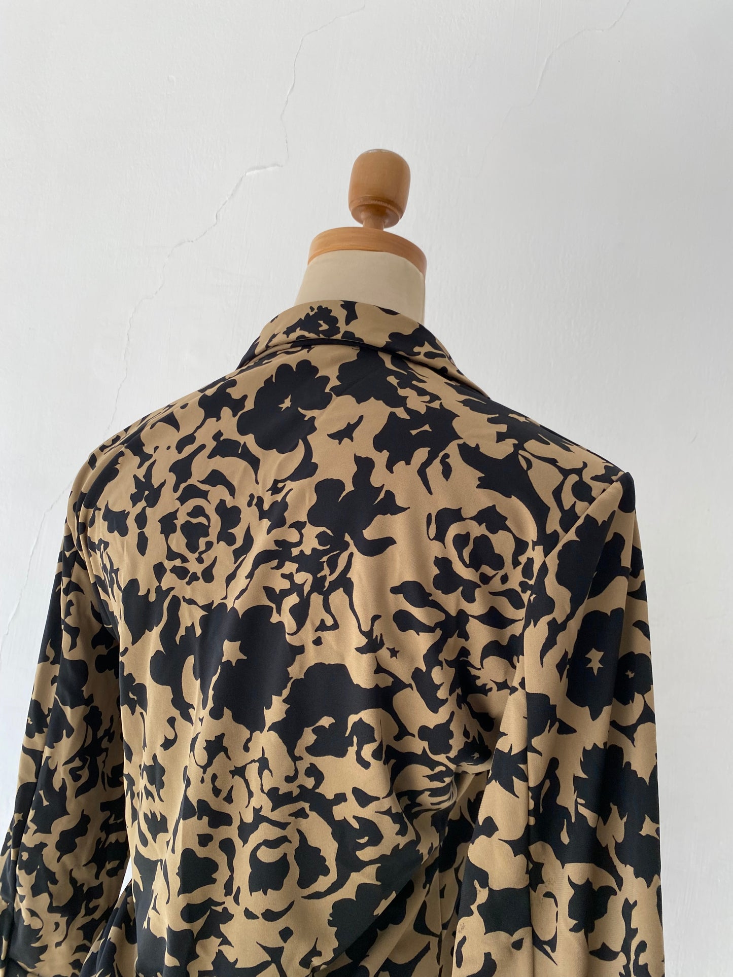 Beige and black crossover blouse