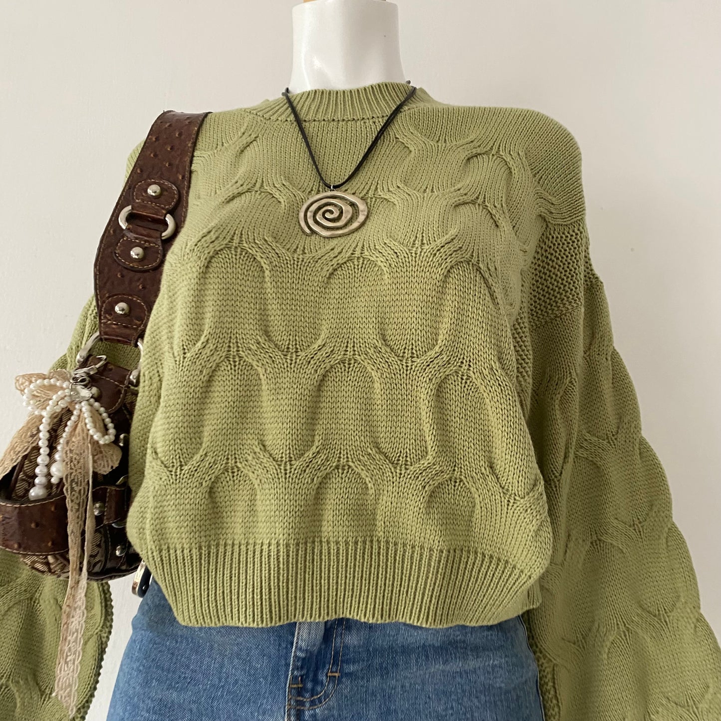 Waist-high sweater with braided design