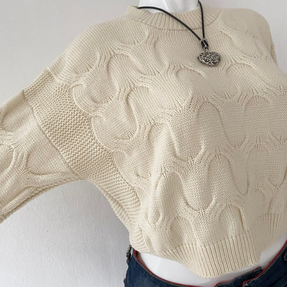 Pearl waist sweater with interwoven design