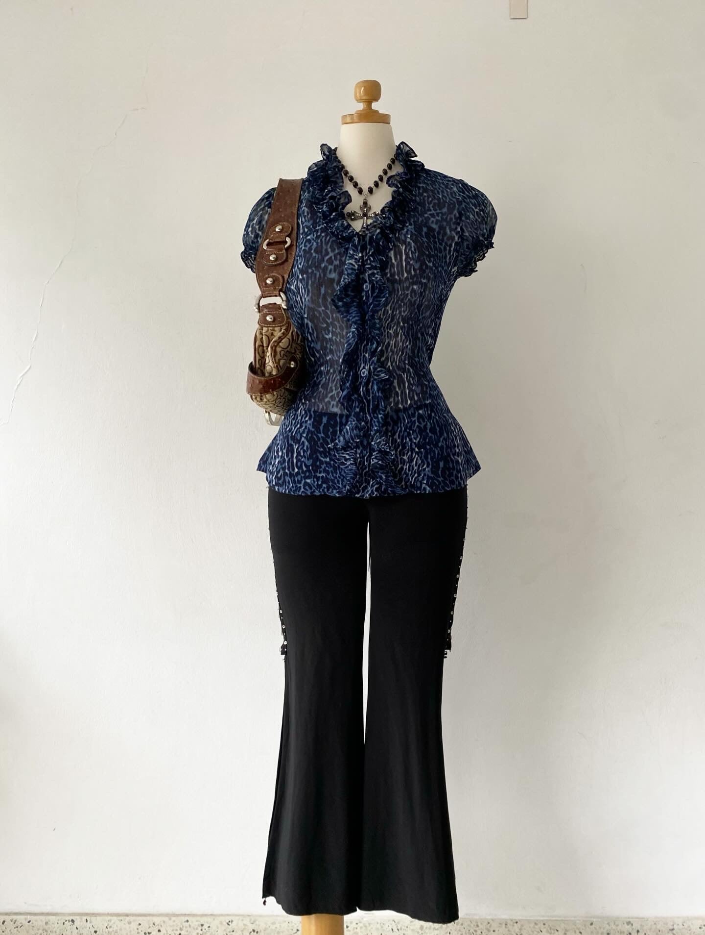 Cheetah print blouse with bow on the back