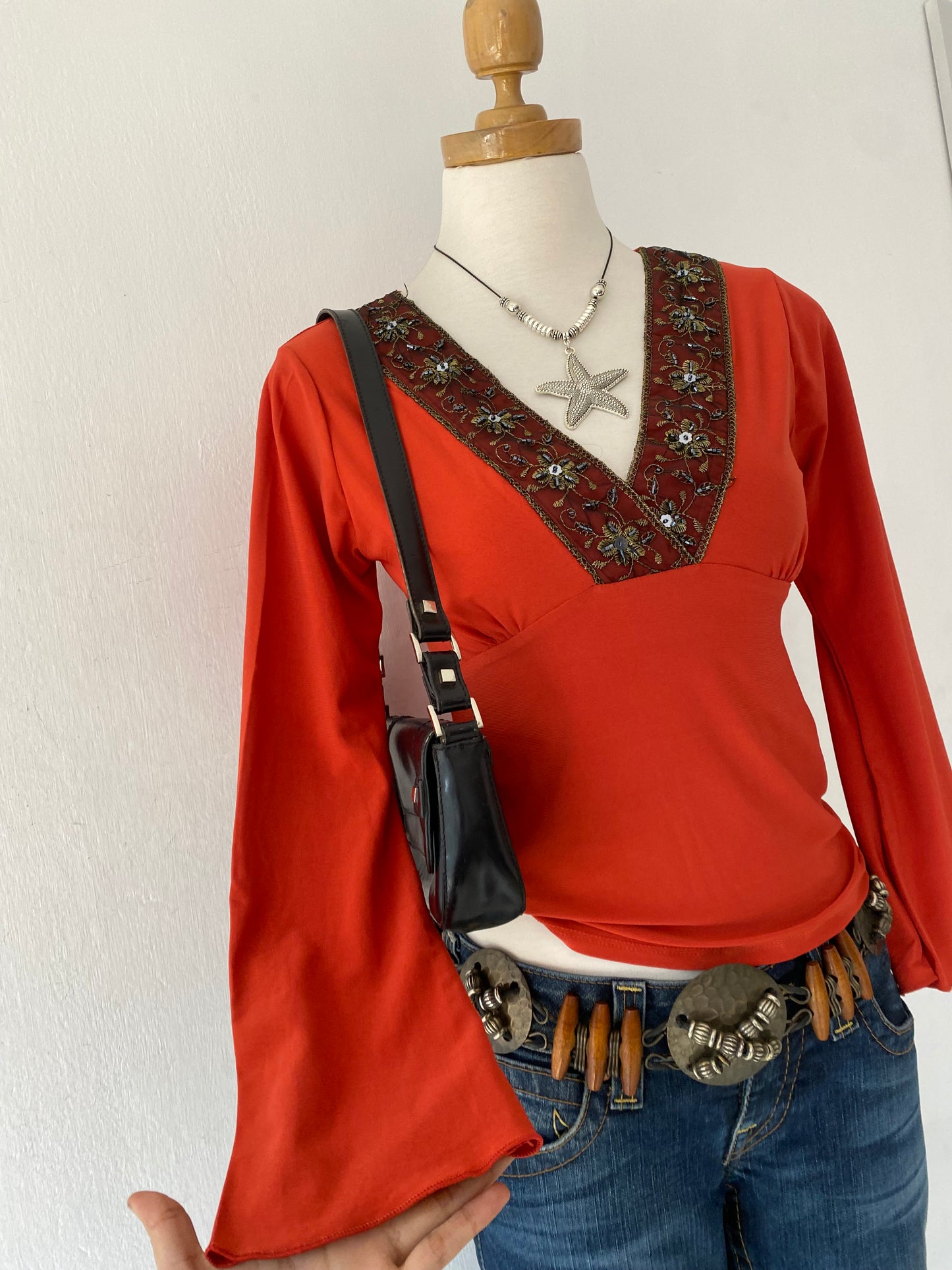 Bell-sleeved top