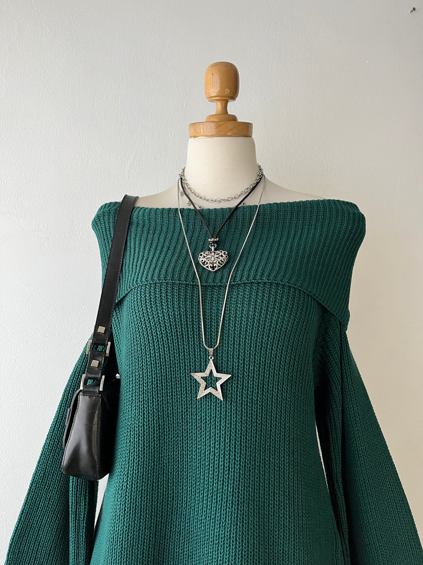 Green off-the-shoulder sweater with wide sleeves