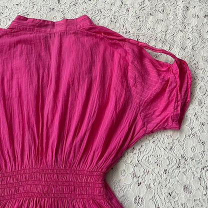 Pink blouse with a bow at the waist