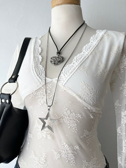 White lace top with flared sleeves
