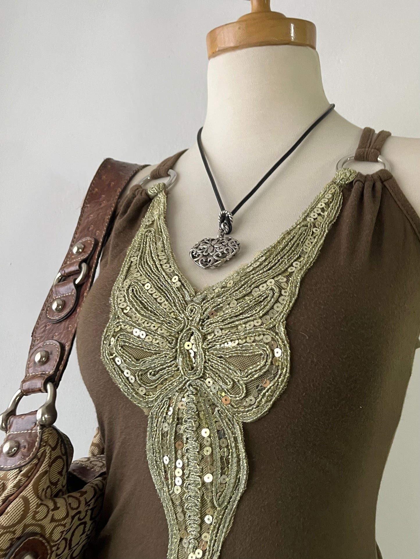 Top with embroidered butterfly design