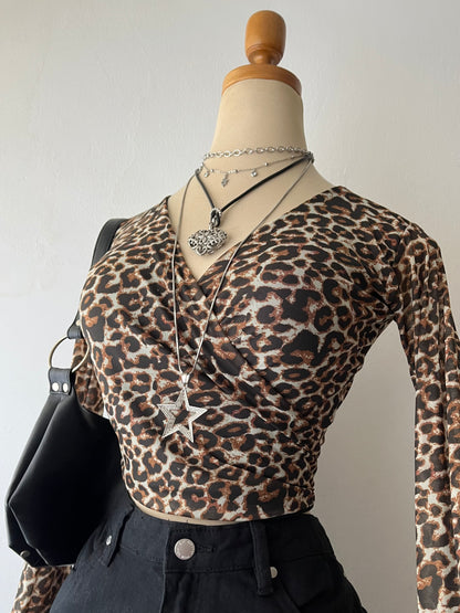 Animal print wrap-around blouse with flared sleeves