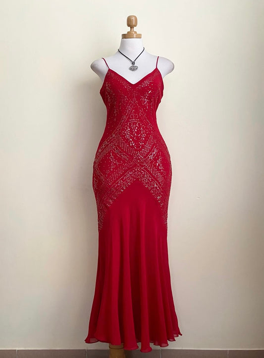 Red dress with silver appliqués