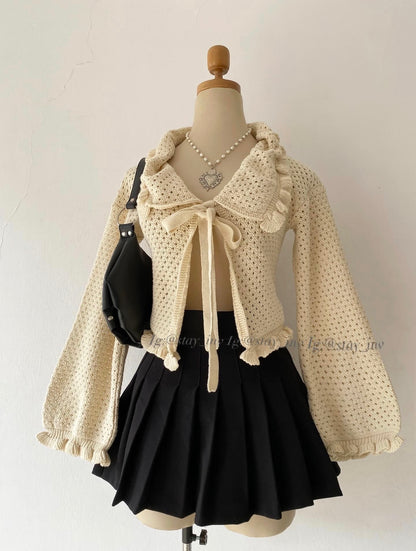 Knitted cardigan with bow