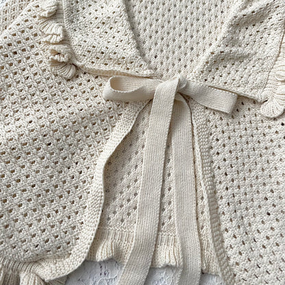 Knitted cardigan with bow