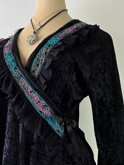 Wrap blouse with embroidered designs