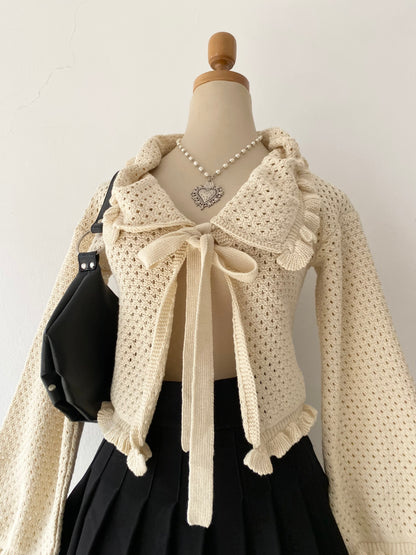 Knitted cardigan with bow