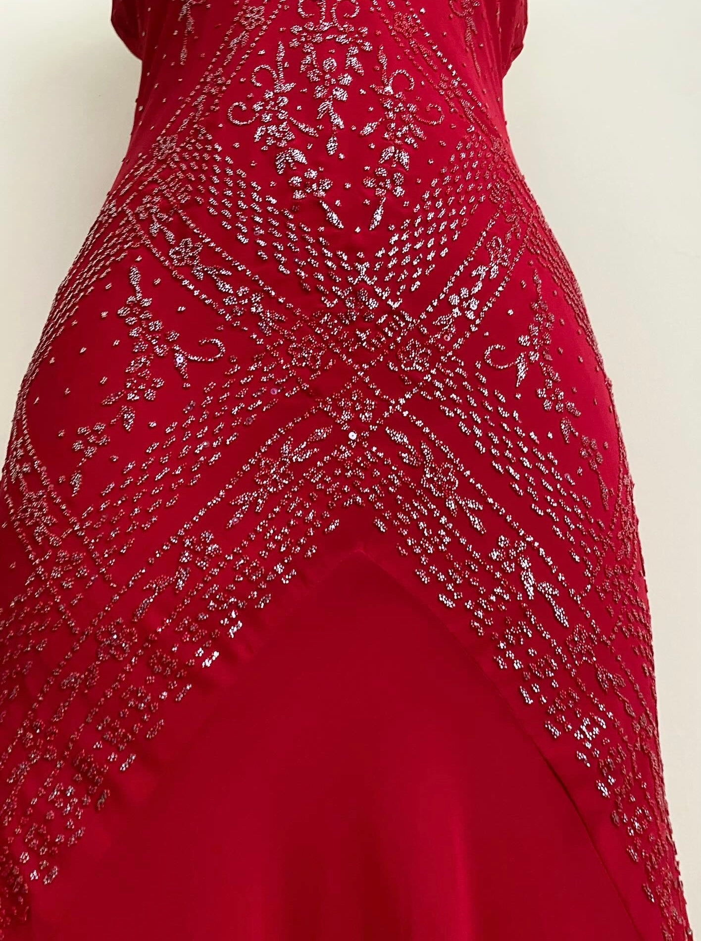 Red dress with silver appliqués