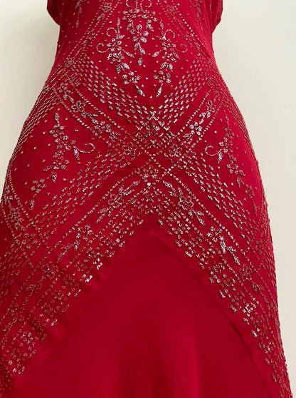 Red dress with silver appliqués