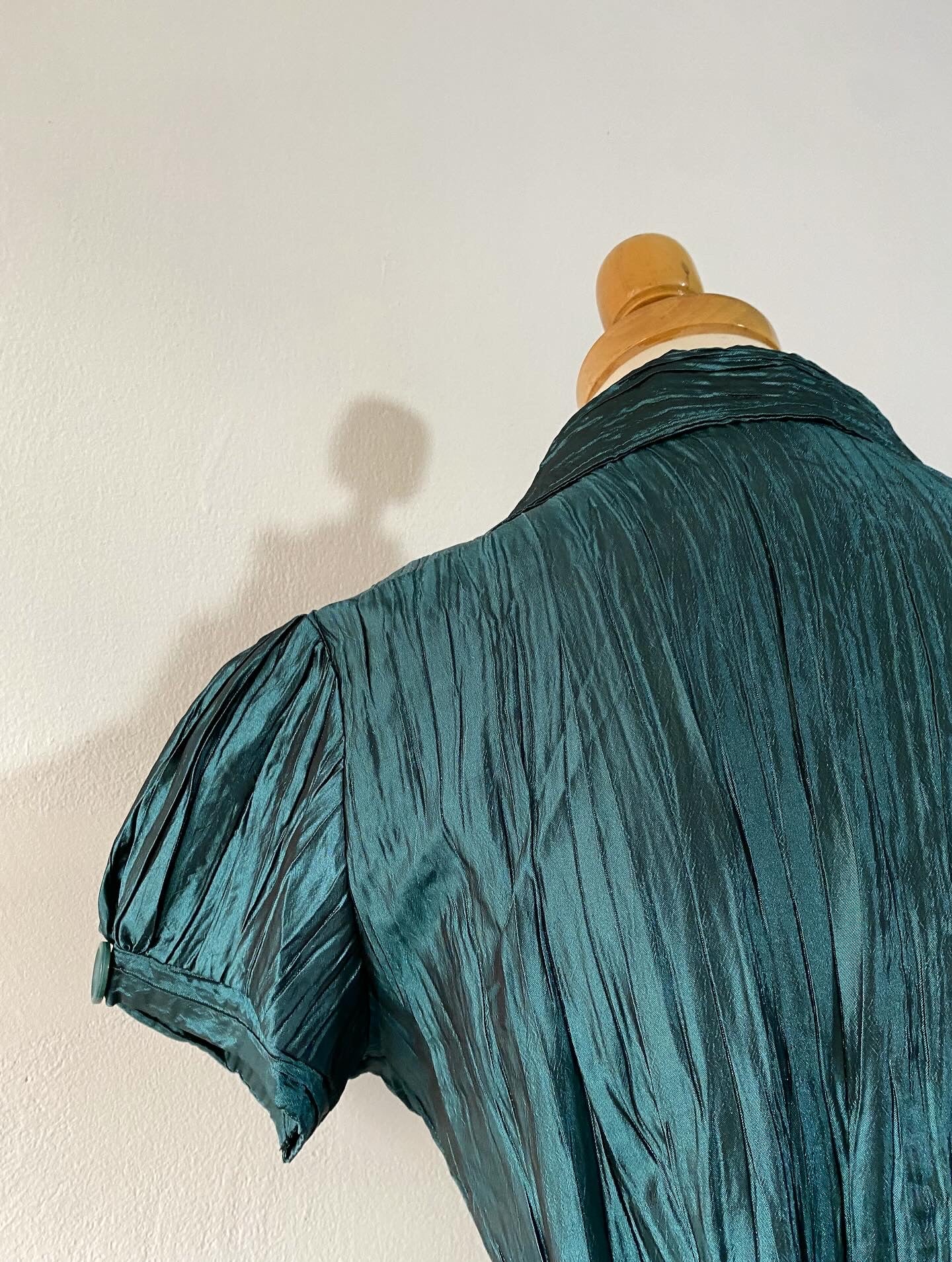 Iridescent green top