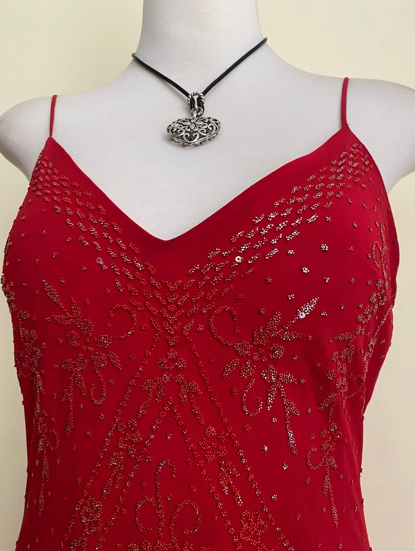 Red dress with silver appliqués