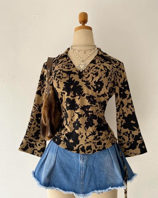 Beige and black crossover blouse