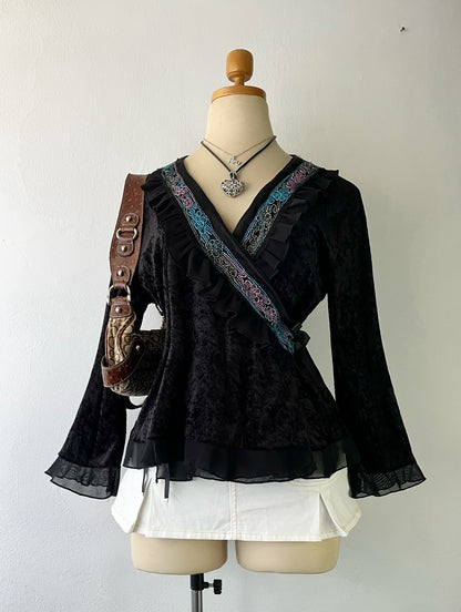 Wrap blouse with embroidered designs