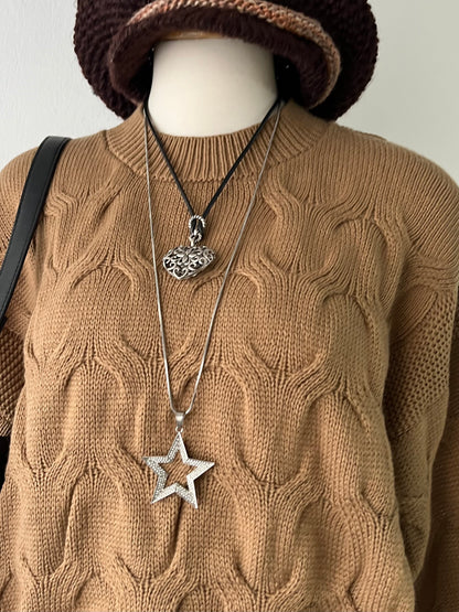 Knitted waist sweater with interwoven design