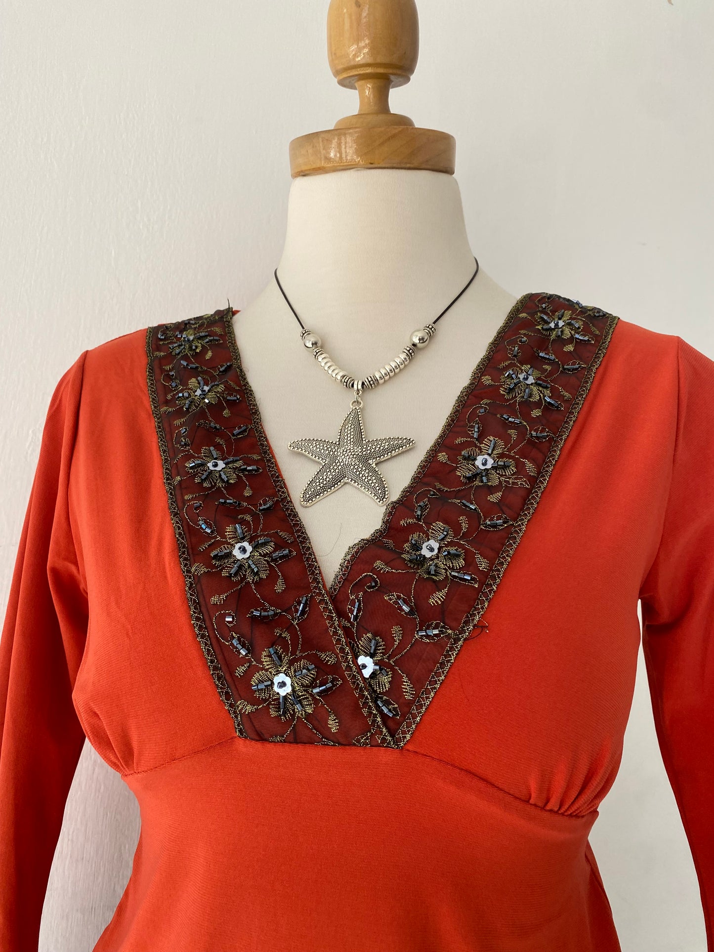 Bell-sleeved top