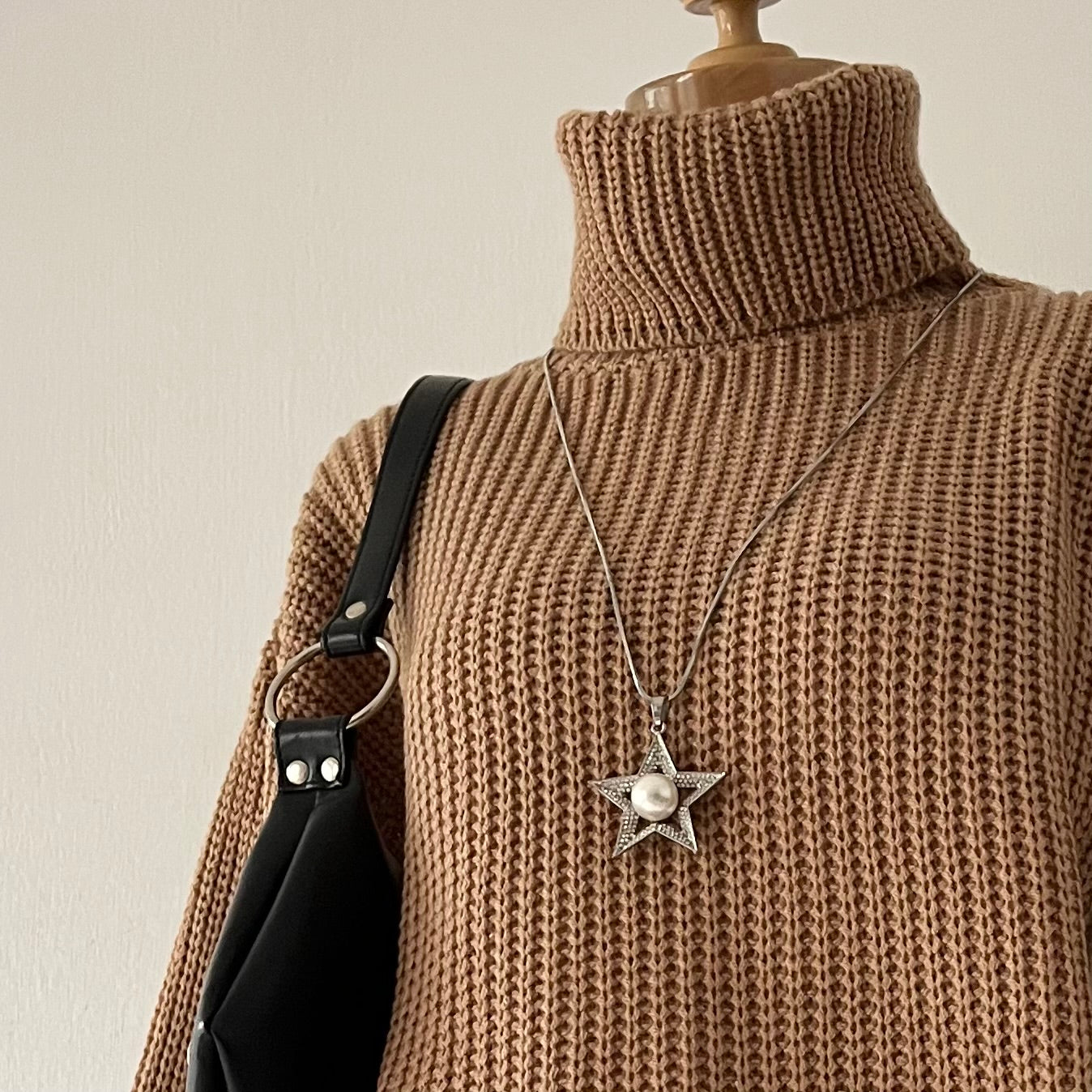 high-neck sweater with wide sleeves