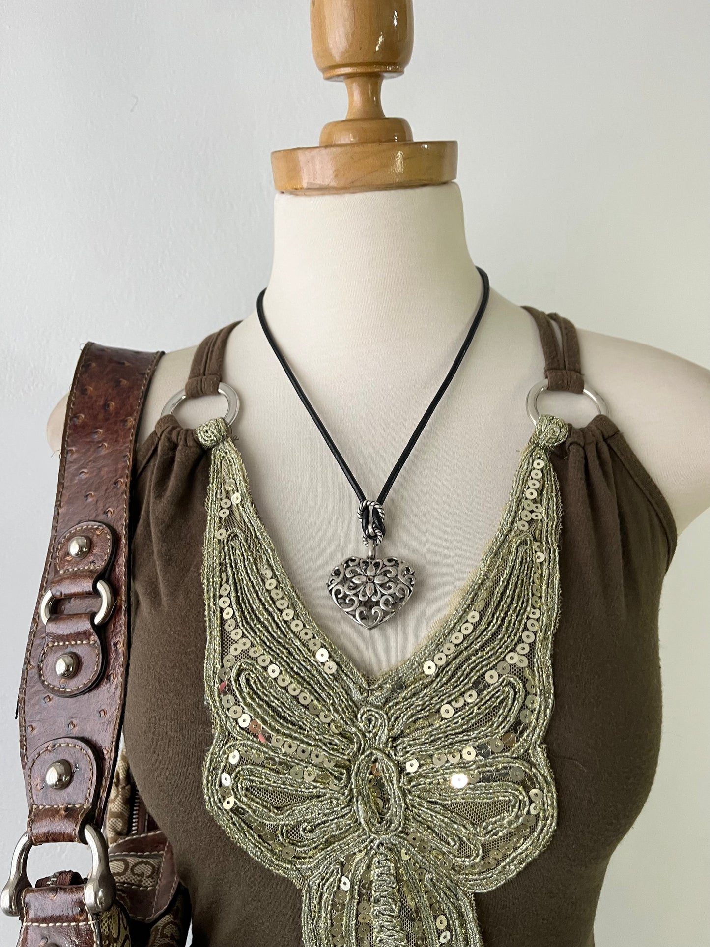 Top with embroidered butterfly design