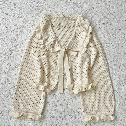 Knitted cardigan with bow